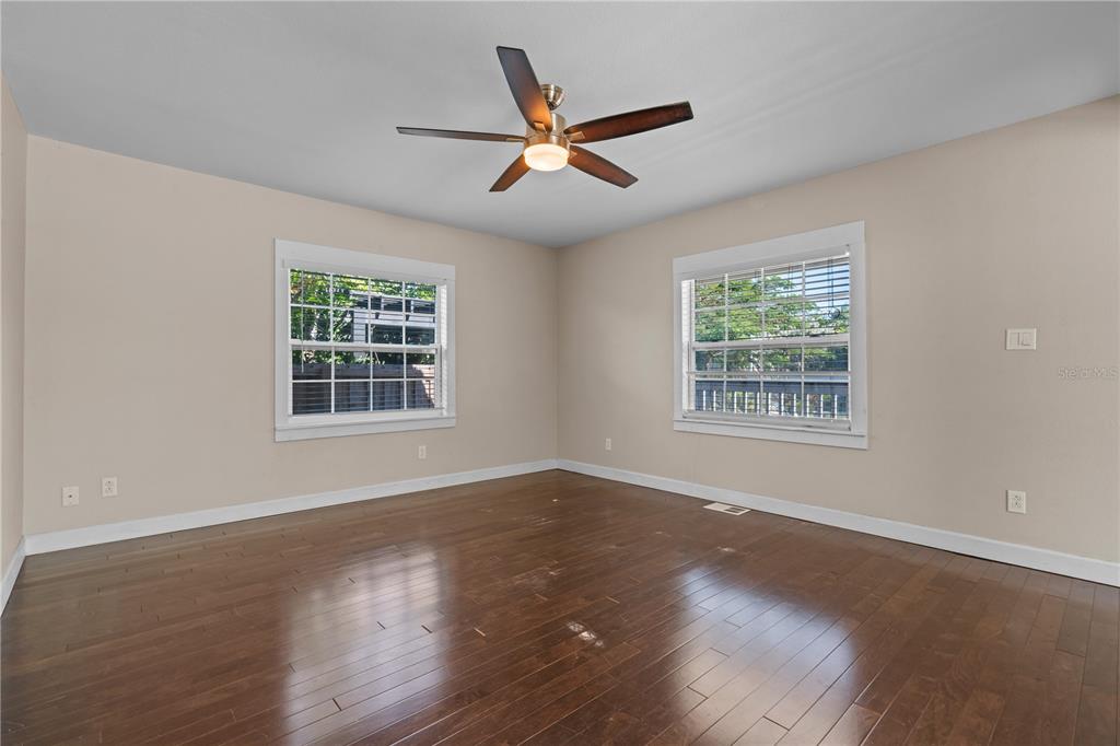 222 25th Street North St. Petersburg, FL 33713 - Photo 19 of 32 a view of an empty room with wooden floor and a window