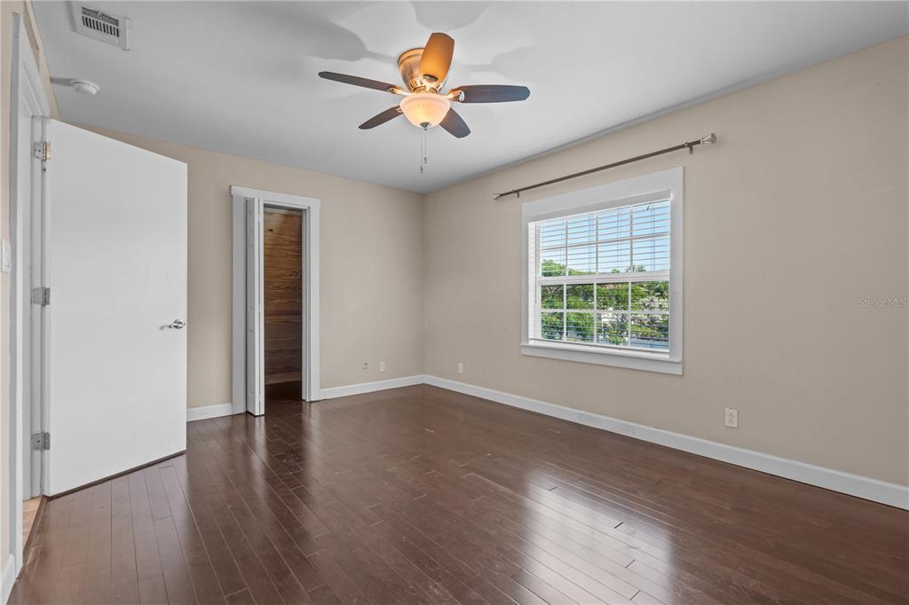 222 25th Street North St. Petersburg, FL 33713 - Photo 21 of 32 an empty room with wooden floor and windows