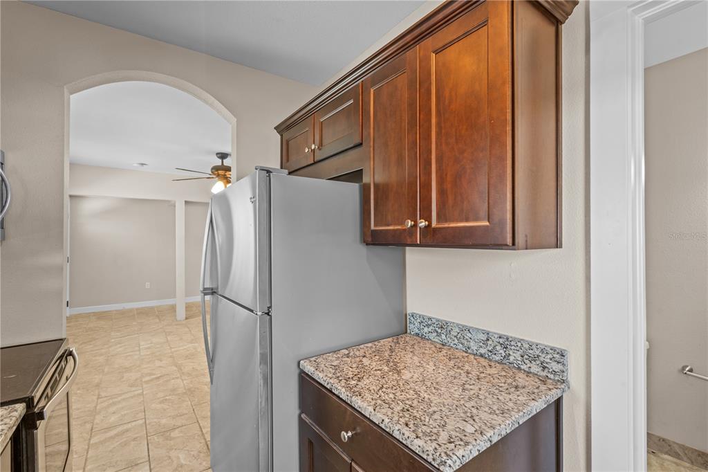 222 25th Street North St. Petersburg, FL 33713 - Photo 27 of 32 a kitchen with stainless steel appliances granite countertop a refrigerator and a sink
