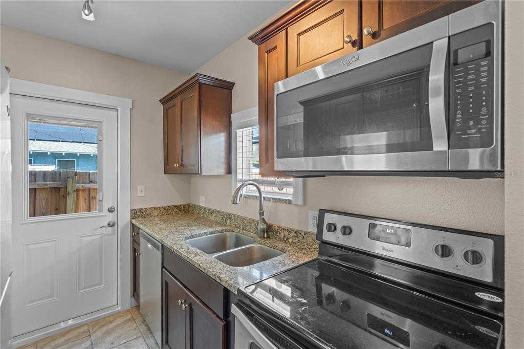 222 25th Street North St. Petersburg, FL 33713 - Photo 31 of 32 a kitchen with a stove and a sink