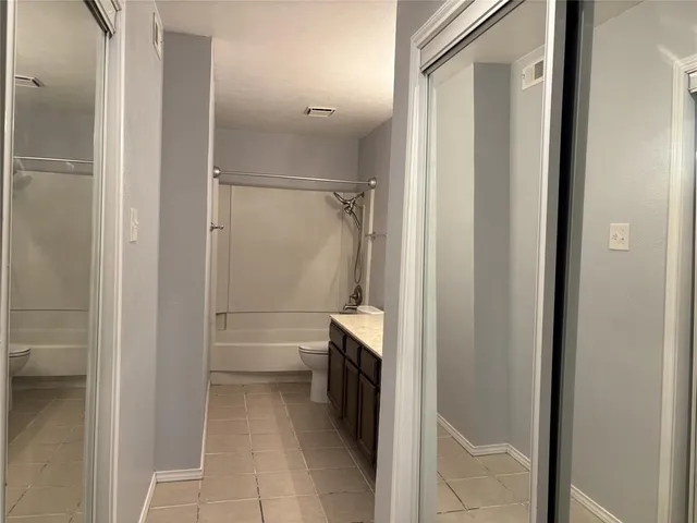 a bathroom with a shower and a sink