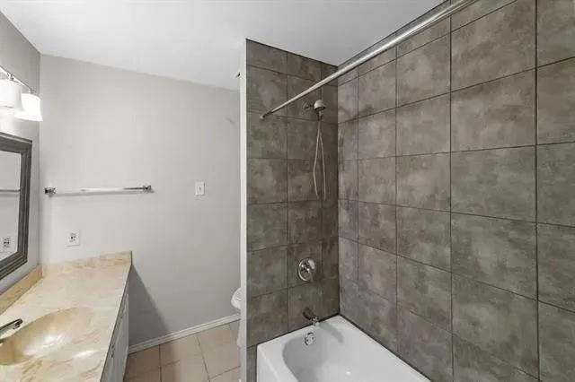 a bathroom with a shower and toilet