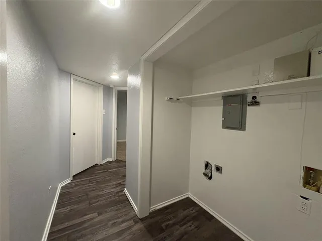 a view of a room with wooden floor