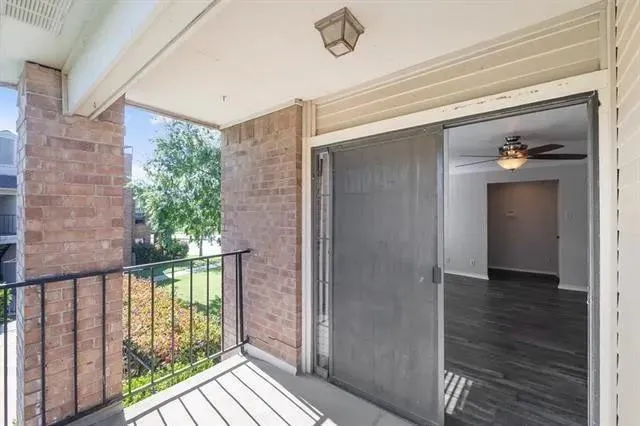 a view of a balcony from a hallway