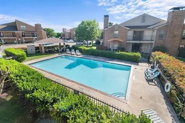 an aerial view of a house with a garden and plants