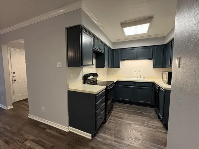 a kitchen with a stove and a refrigerator