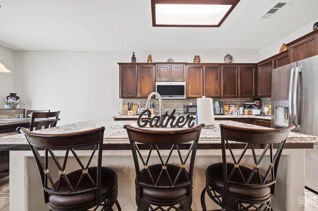 a kitchen with a table and chairs