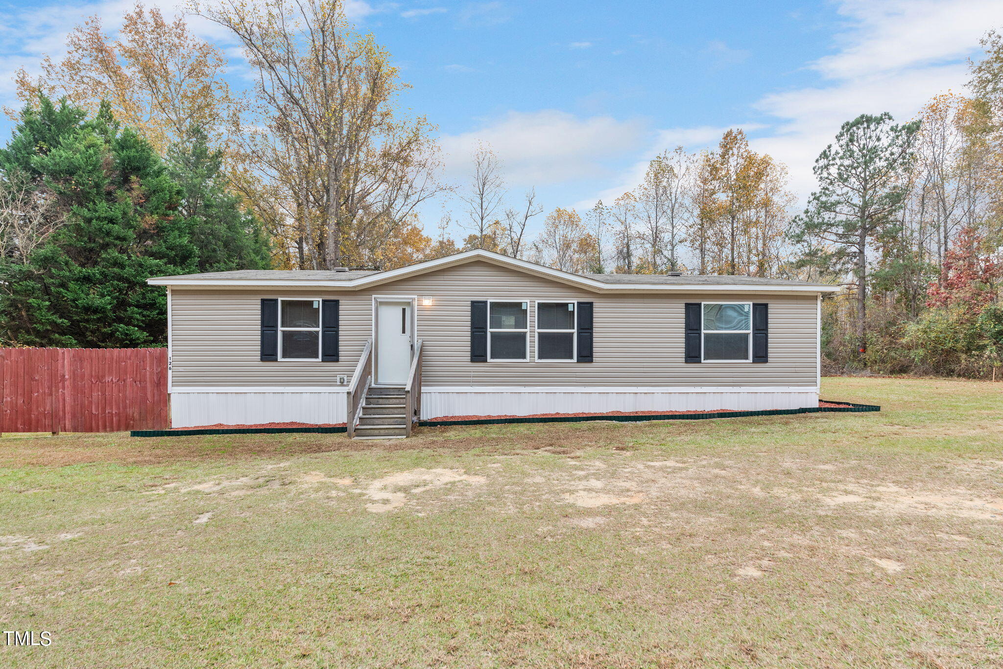 126 Ridge Road Angier, NC 27501 - Photo 1 of 30 a view of a house with a yard