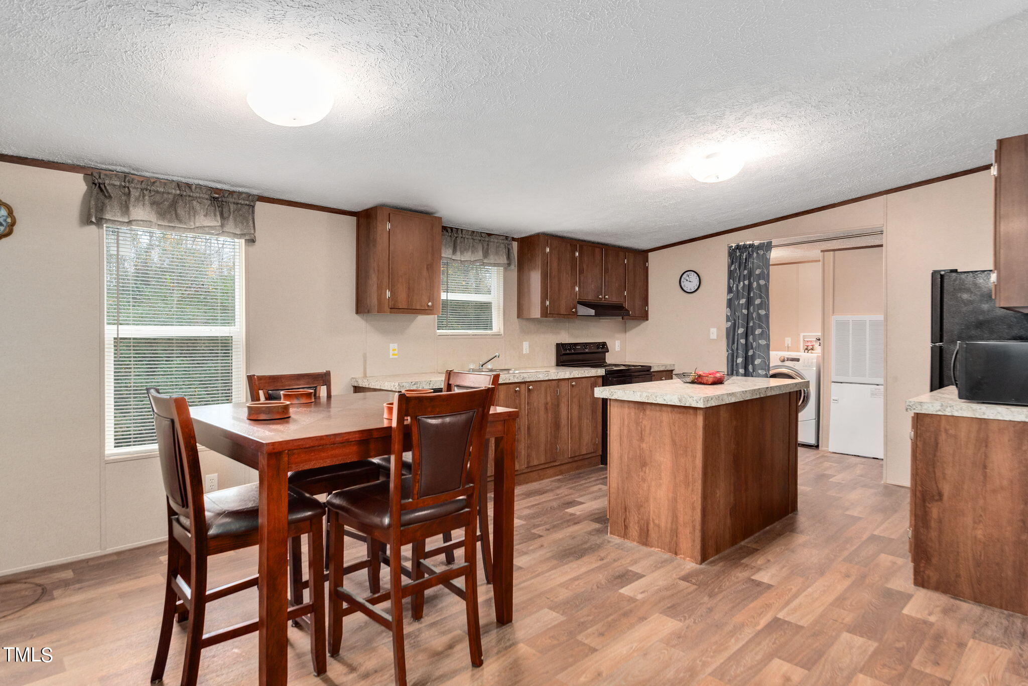 126 Ridge Road Angier, NC 27501 - Photo 11 of 30 a view of a dining room with furniture and a window