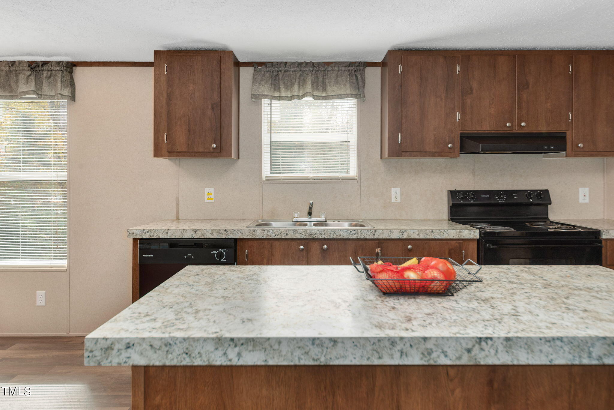 126 Ridge Road Angier, NC 27501 - Photo 13 of 30 a kitchen with kitchen island granite countertop a stove a sink and a microwave