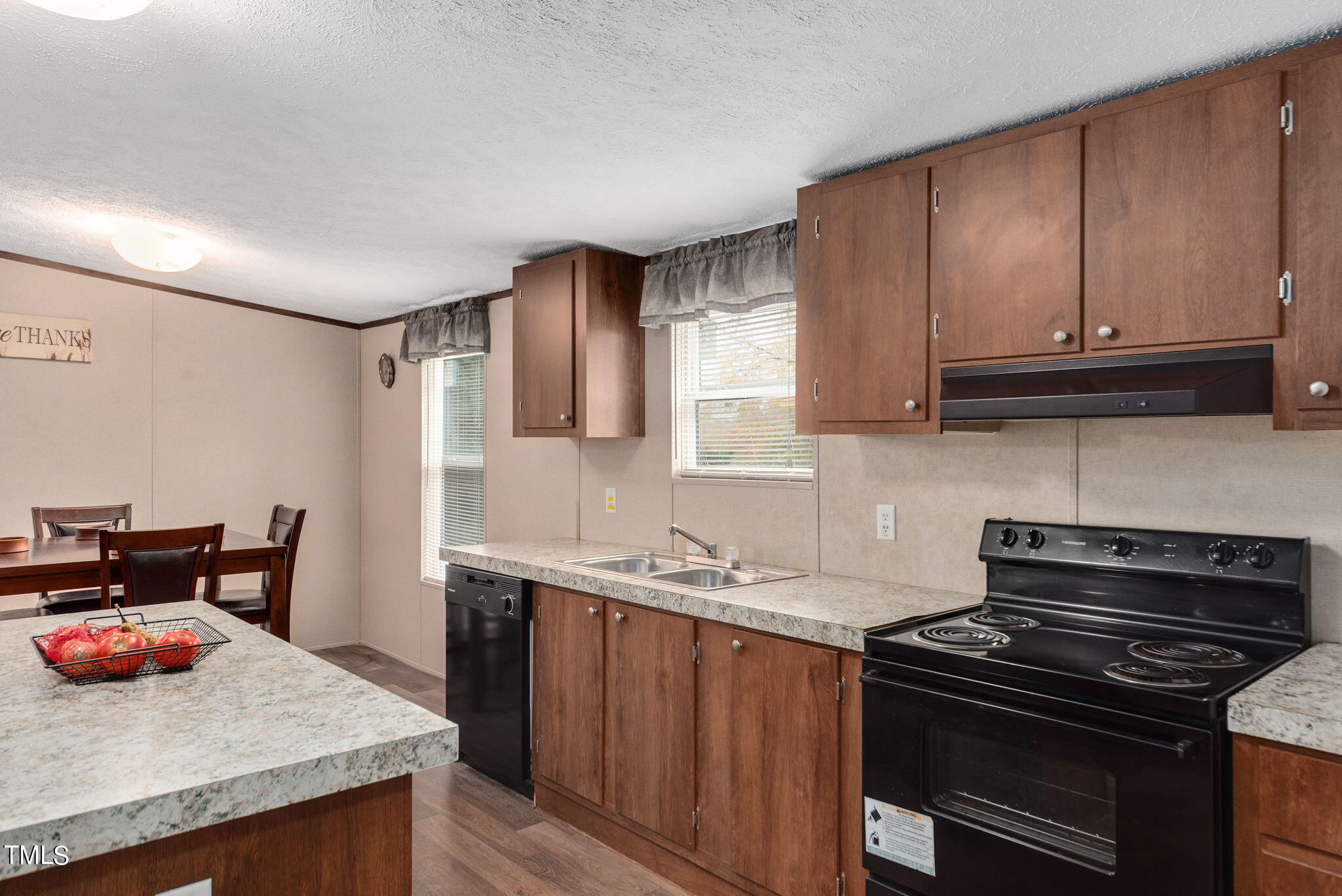 126 Ridge Road Angier, NC 27501 - Photo 15 of 30 a kitchen with granite countertop a stove and a sink