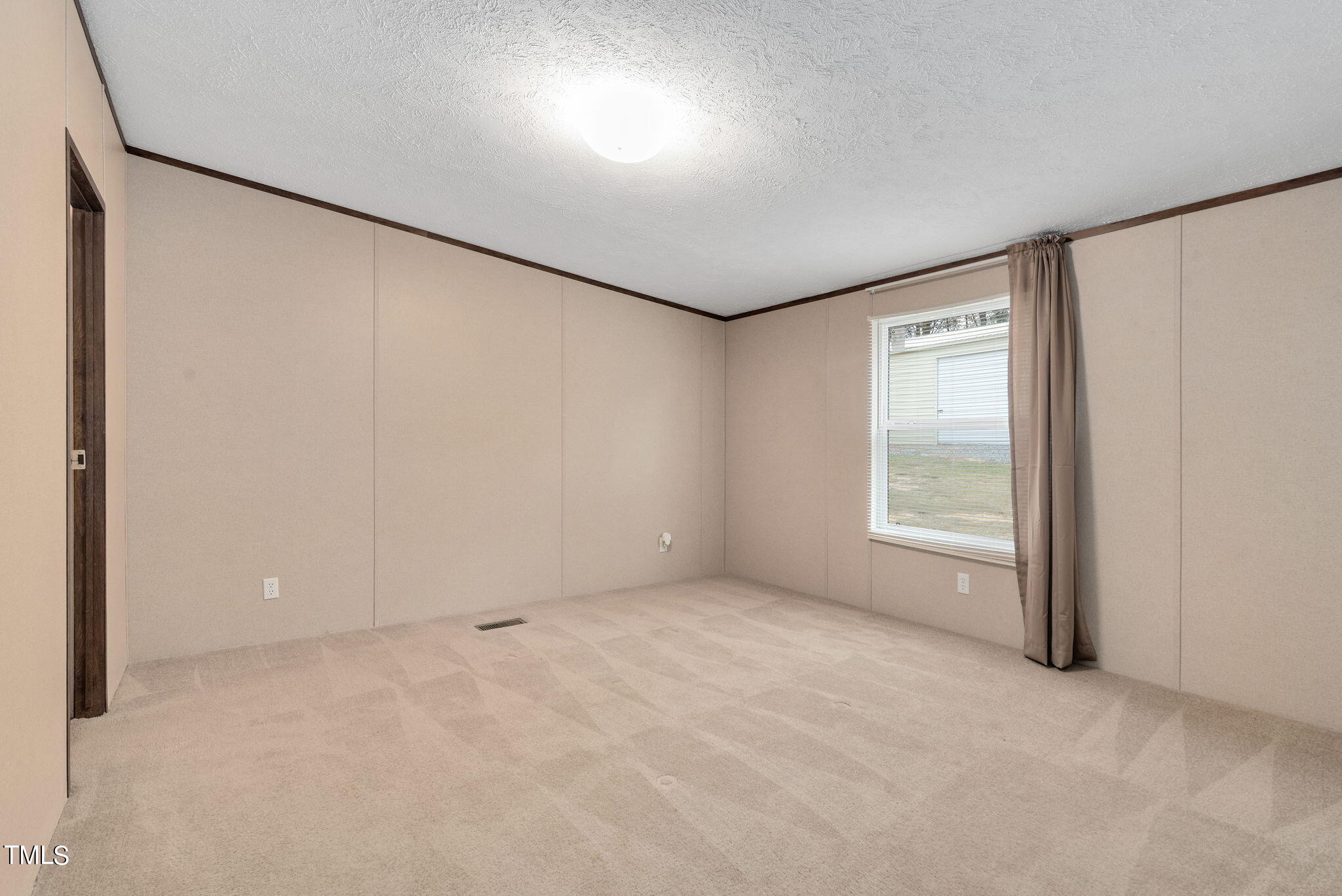 126 Ridge Road Angier, NC 27501 - Photo 17 of 30 an empty room with a empty space and windows