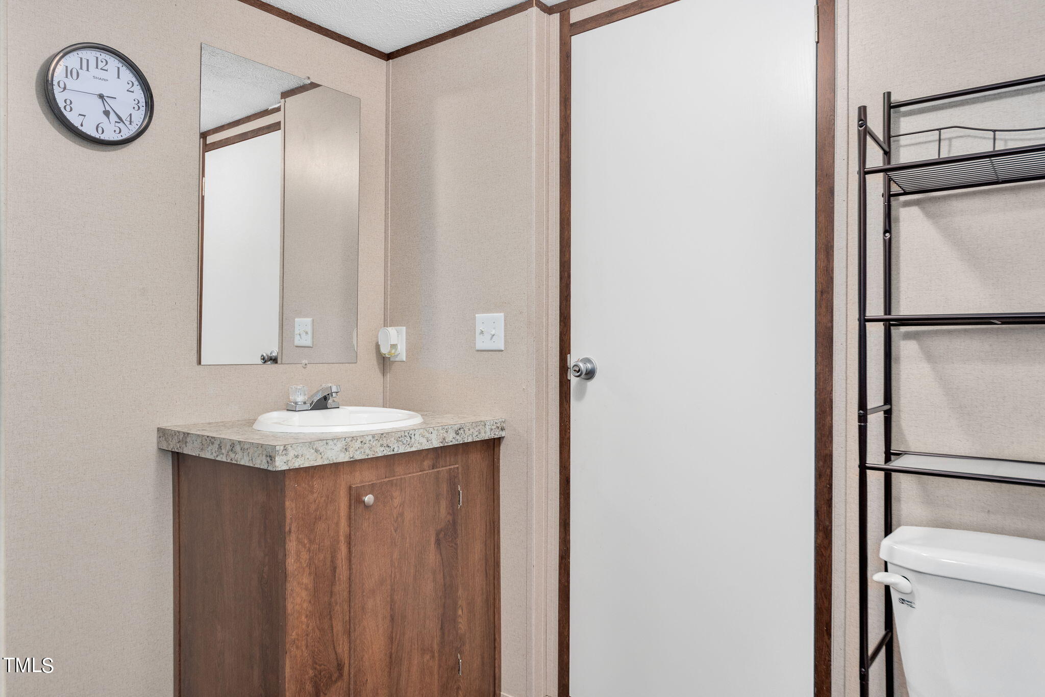 126 Ridge Road Angier, NC 27501 - Photo 20 of 30 a bathroom with a granite countertop sink toilet and a mirror
