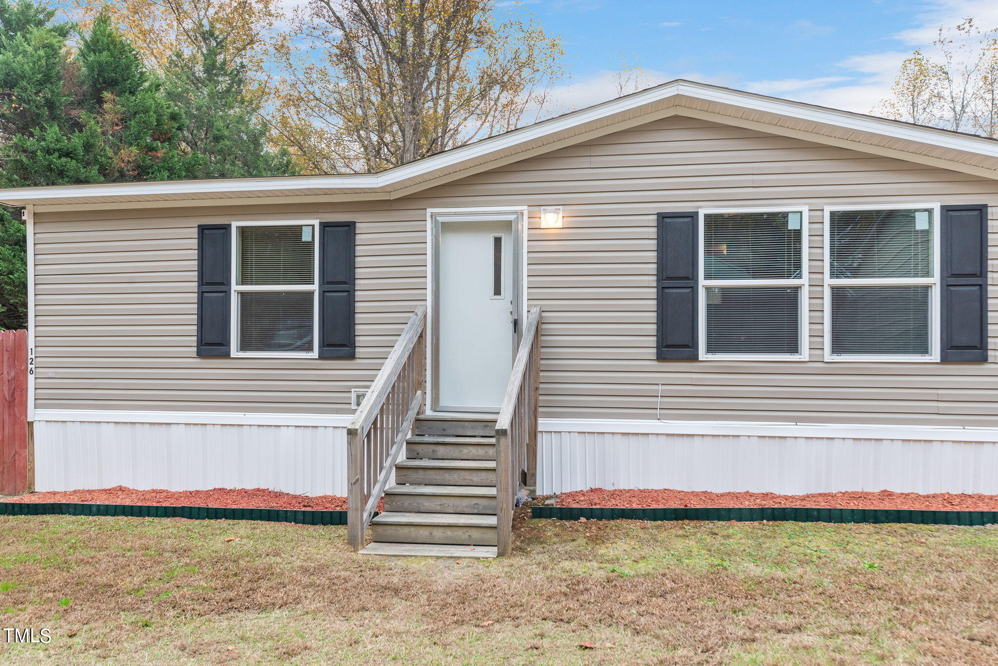 126 Ridge Road Angier, NC 27501 - Photo 2 of 30 a view of a house with backyard and porch