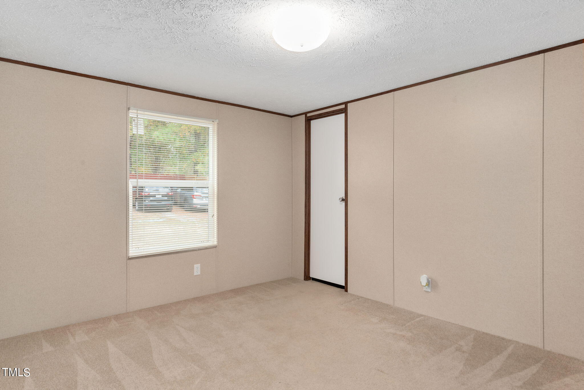 126 Ridge Road Angier, NC 27501 - Photo 21 of 30 a view of an empty room with a window