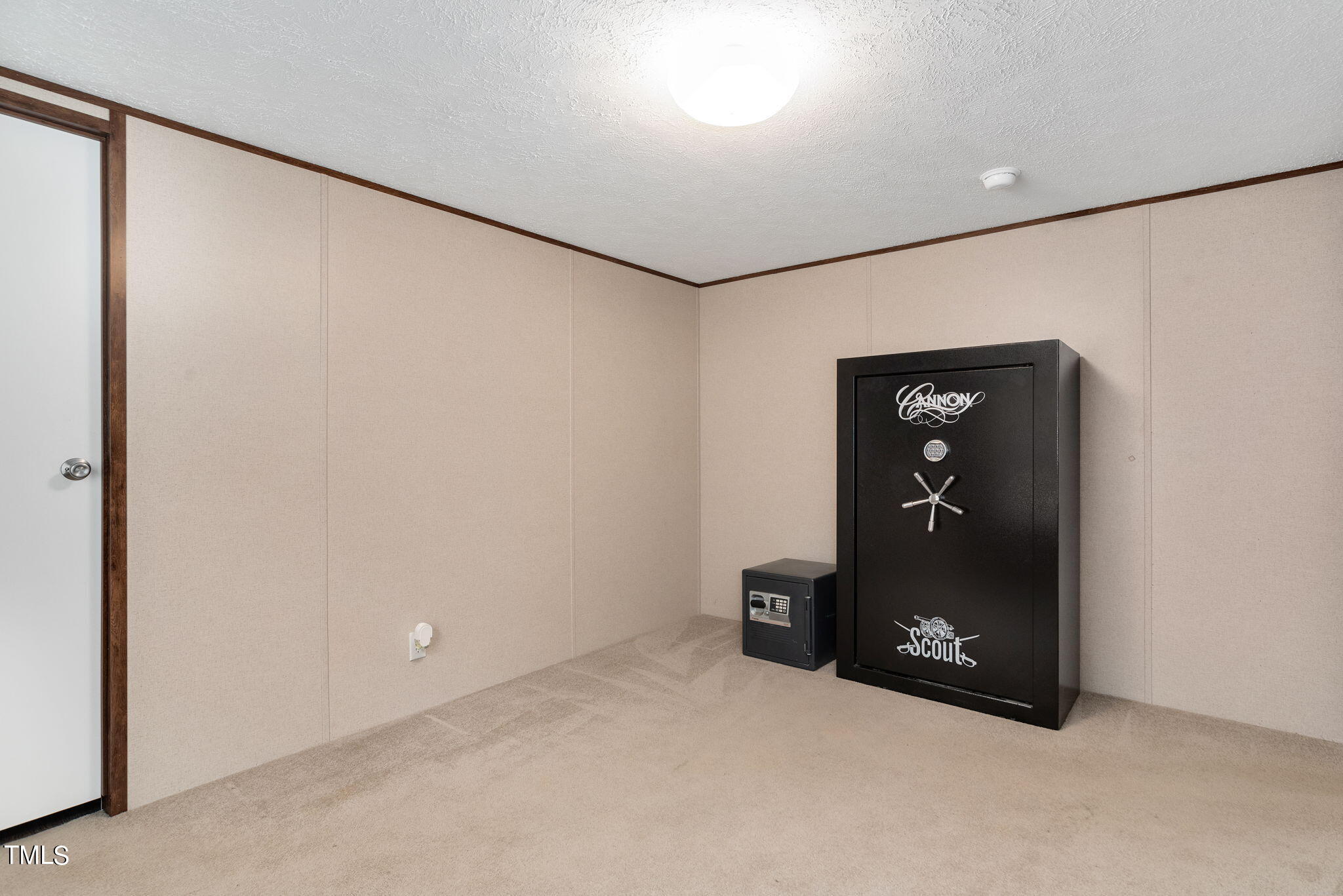 126 Ridge Road Angier, NC 27501 - Photo 22 of 30 an empty room with a door