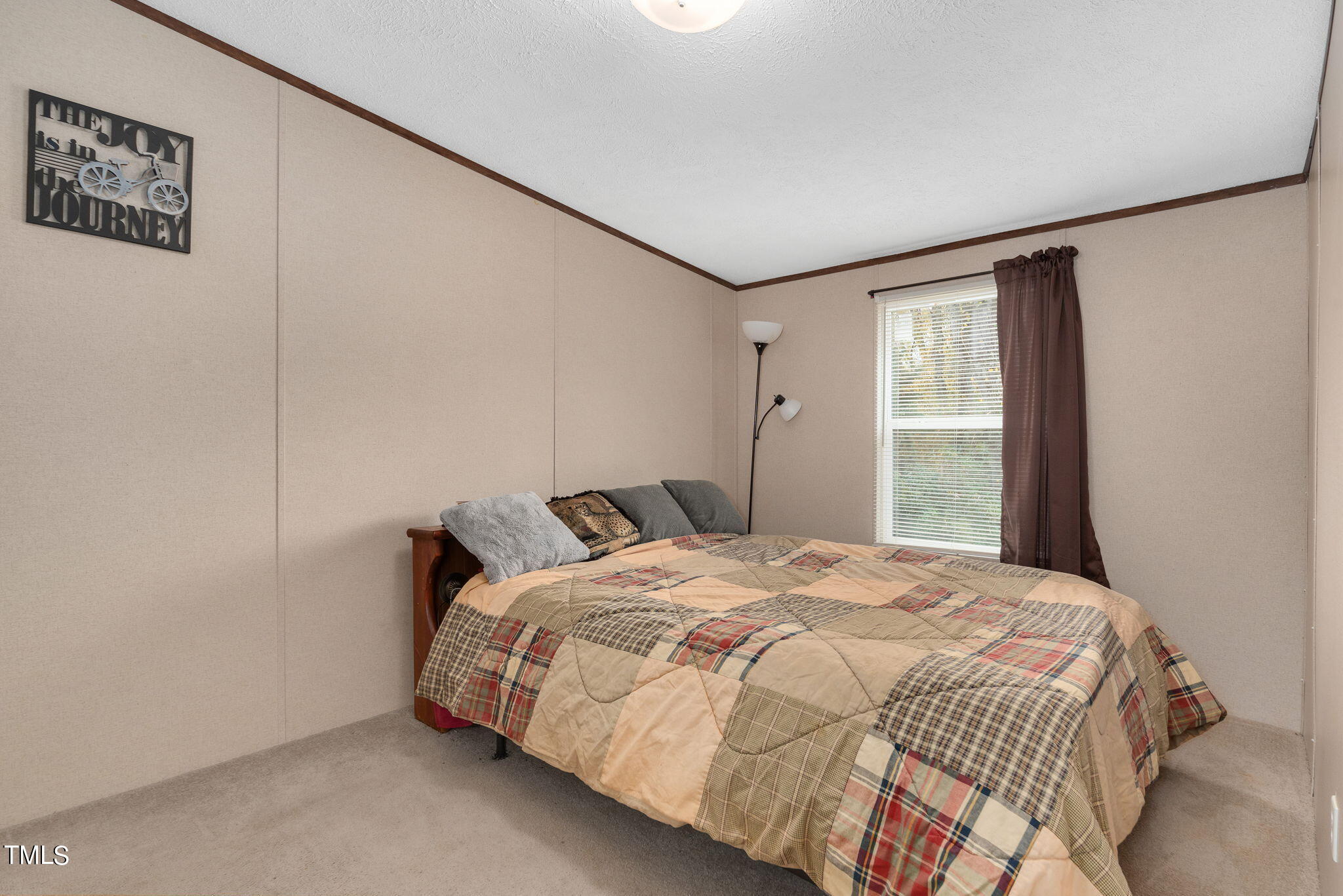 126 Ridge Road Angier, NC 27501 - Photo 23 of 30 a bedroom with a bed and a window