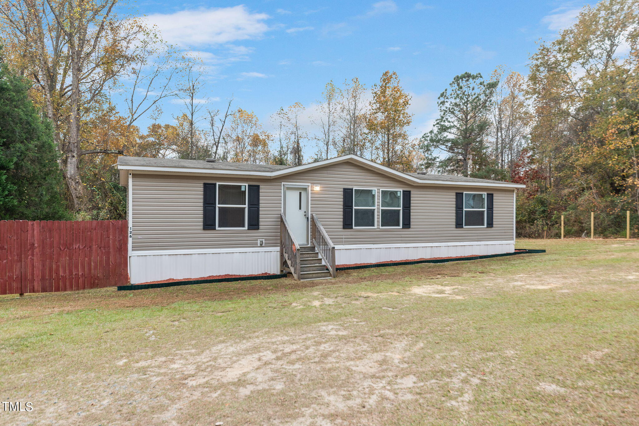 126 Ridge Road Angier, NC 27501 - Photo 24 of 30 a view of a house with a garden