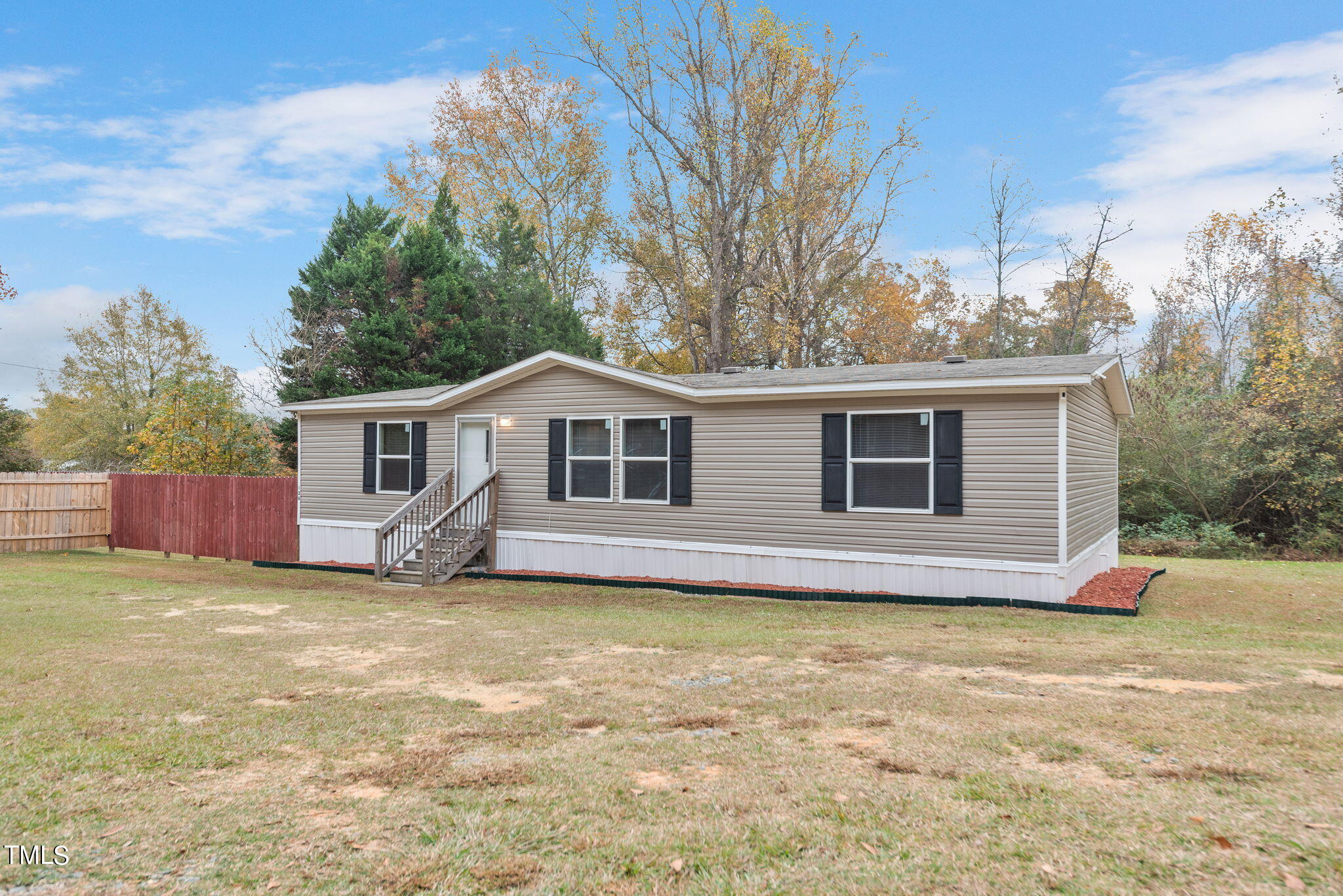 126 Ridge Road Angier, NC 27501 - Photo 3 of 30 a view of a house with a yard