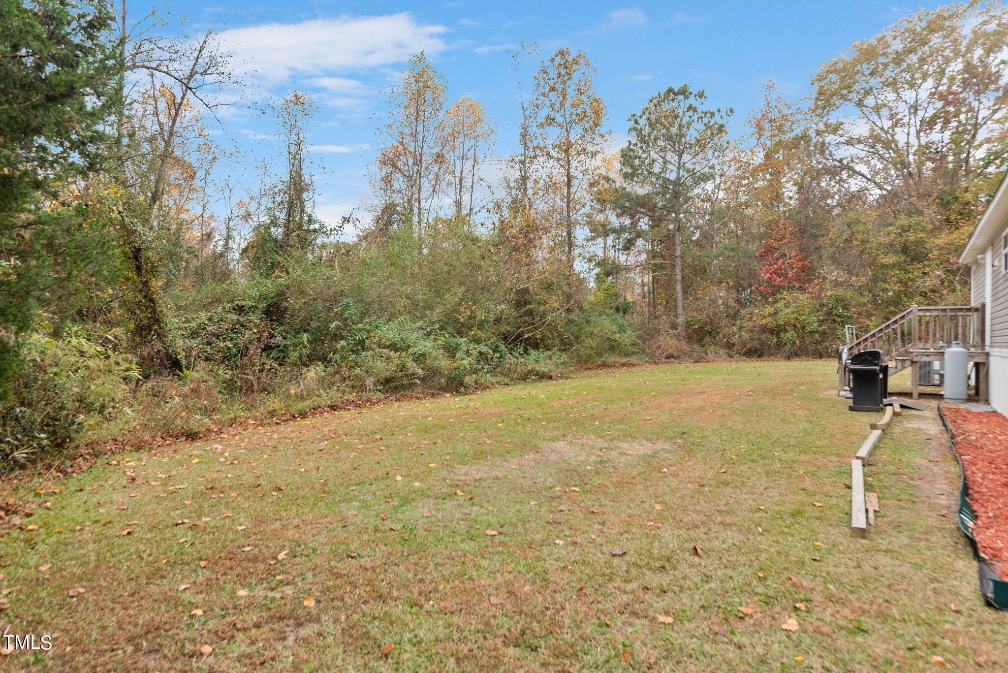 126 Ridge Road Angier, NC 27501 - Photo 7 of 30 a view of a yard with trees