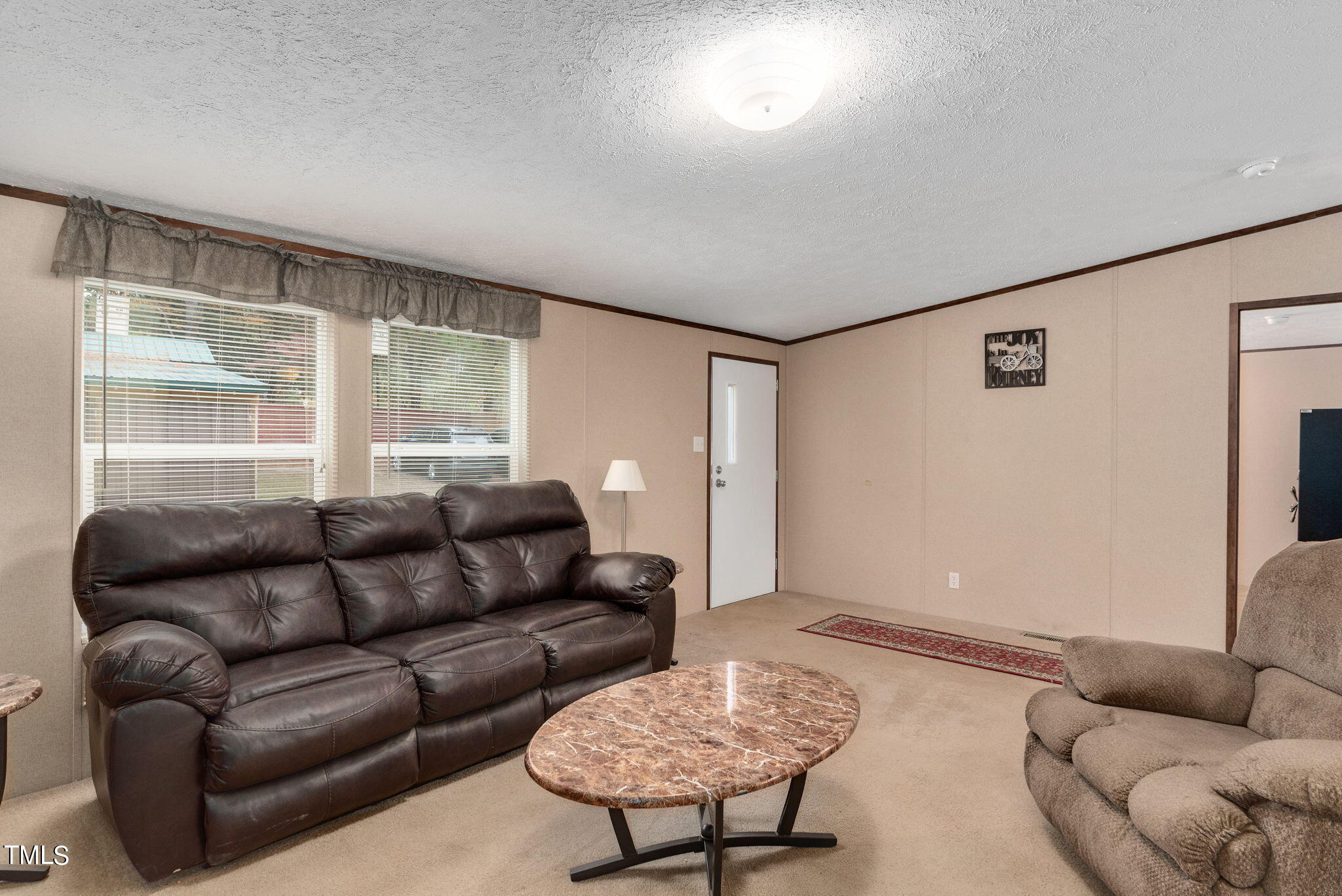 126 Ridge Road Angier, NC 27501 - Photo 10 of 30 a living room with furniture and a large window
