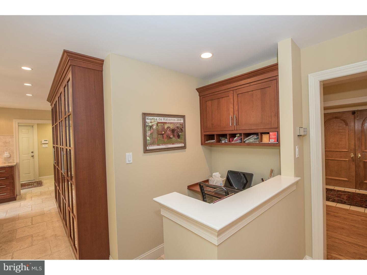 414 Gilpin Road Narberth, PA 19072 - Photo 11 of 25 a white kitchen with sink and a refrigerator