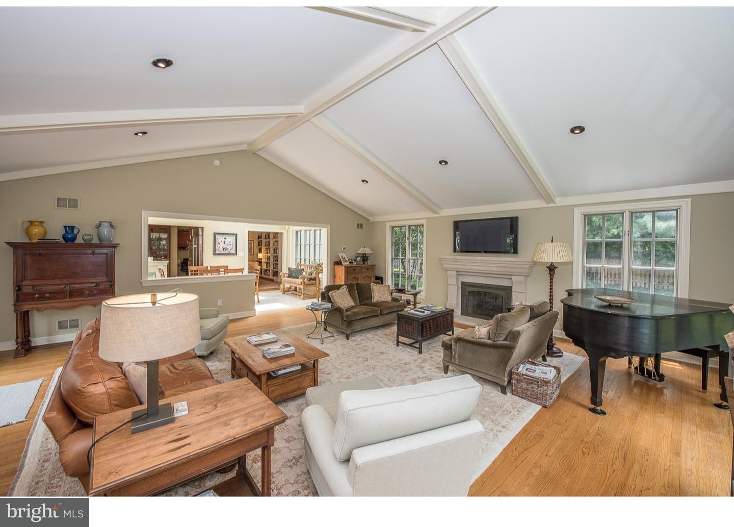 414 Gilpin Road Narberth, PA 19072 - Photo 15 of 25 a living room with furniture a fireplace and a large window