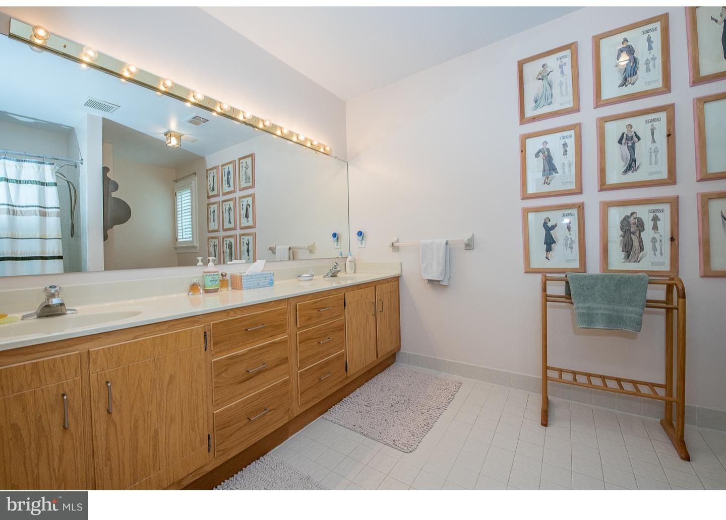 414 Gilpin Road Narberth, PA 19072 - Photo 17 of 25 a bathroom with a sink a mirror and next to a window