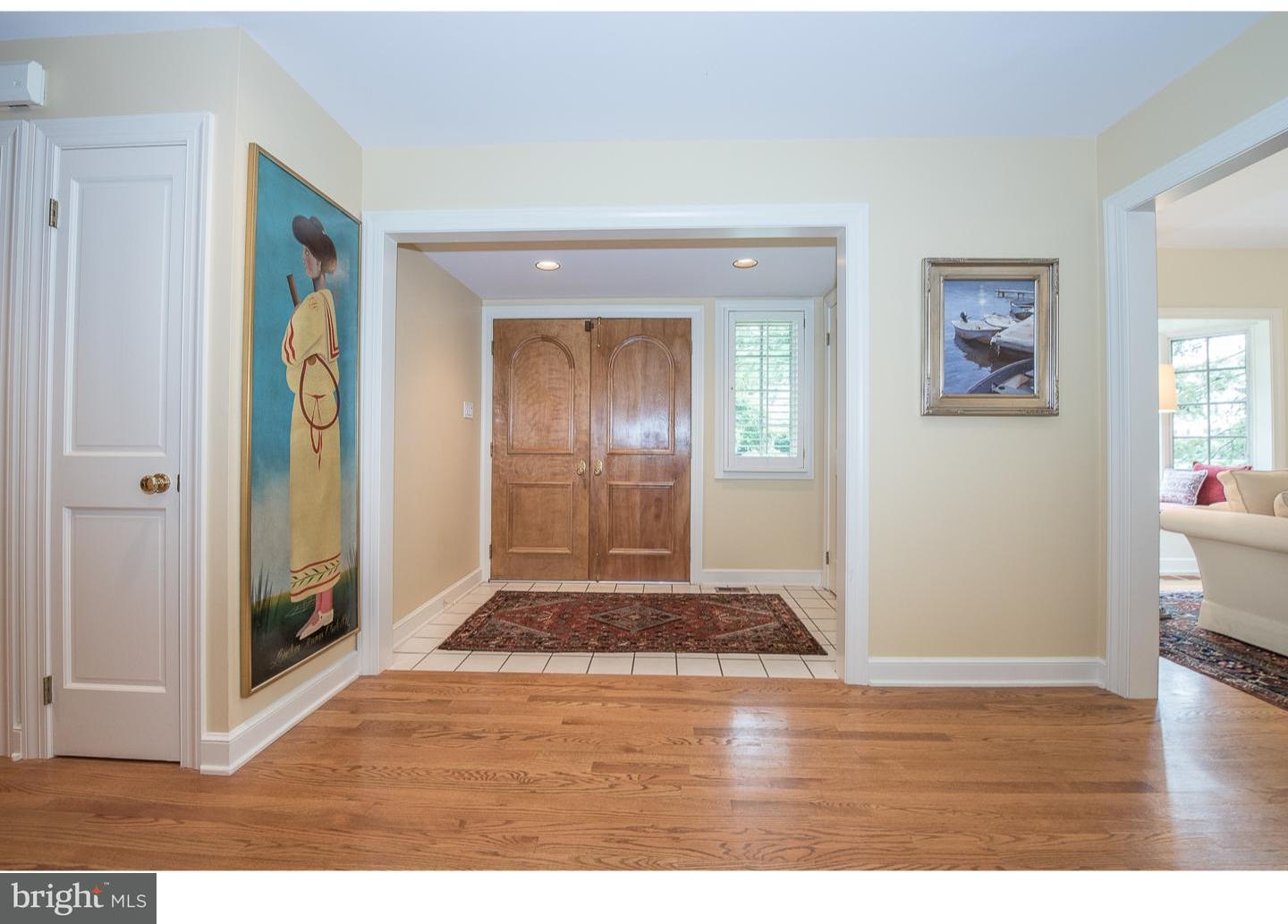 414 Gilpin Road Narberth, PA 19072 - Photo 3 of 25 a view of an empty room with wooden floor and a window