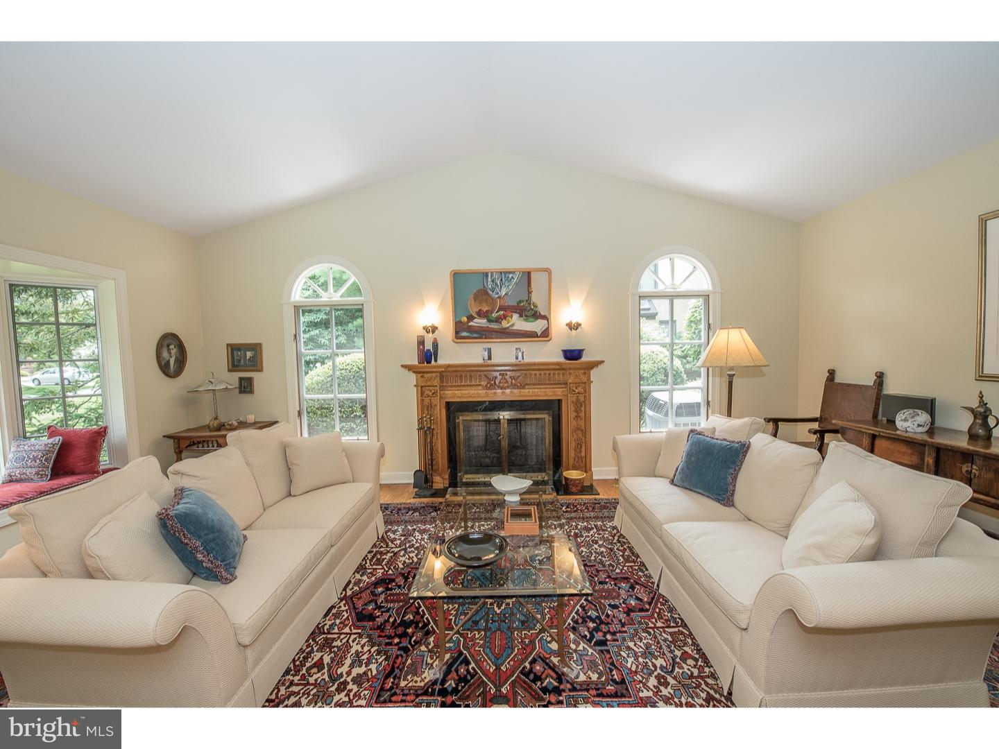 414 Gilpin Road Narberth, PA 19072 - Photo 4 of 25 a living room with furniture a rug and a fireplace