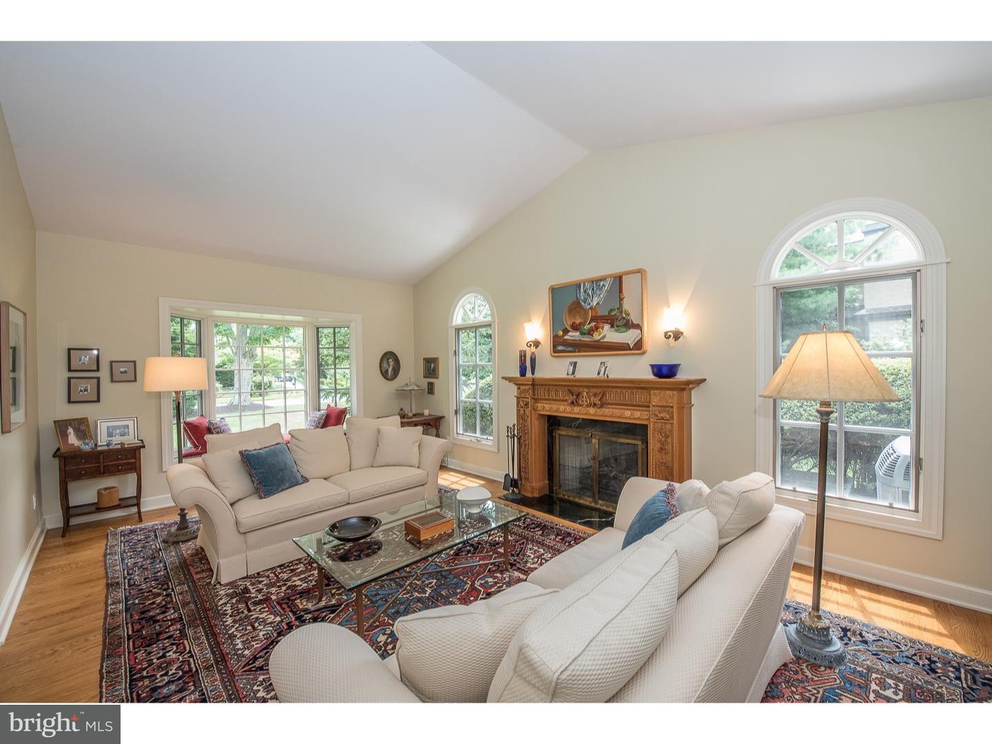 414 Gilpin Road Narberth, PA 19072 - Photo 5 of 25 a living room with furniture a fireplace and a large window