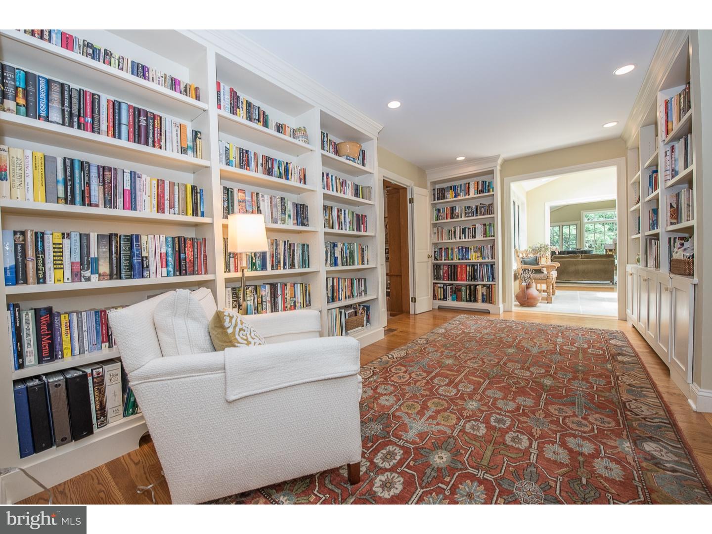 414 Gilpin Road Narberth, PA 19072 - Photo 7 of 25 a living room with furniture and a book shelf