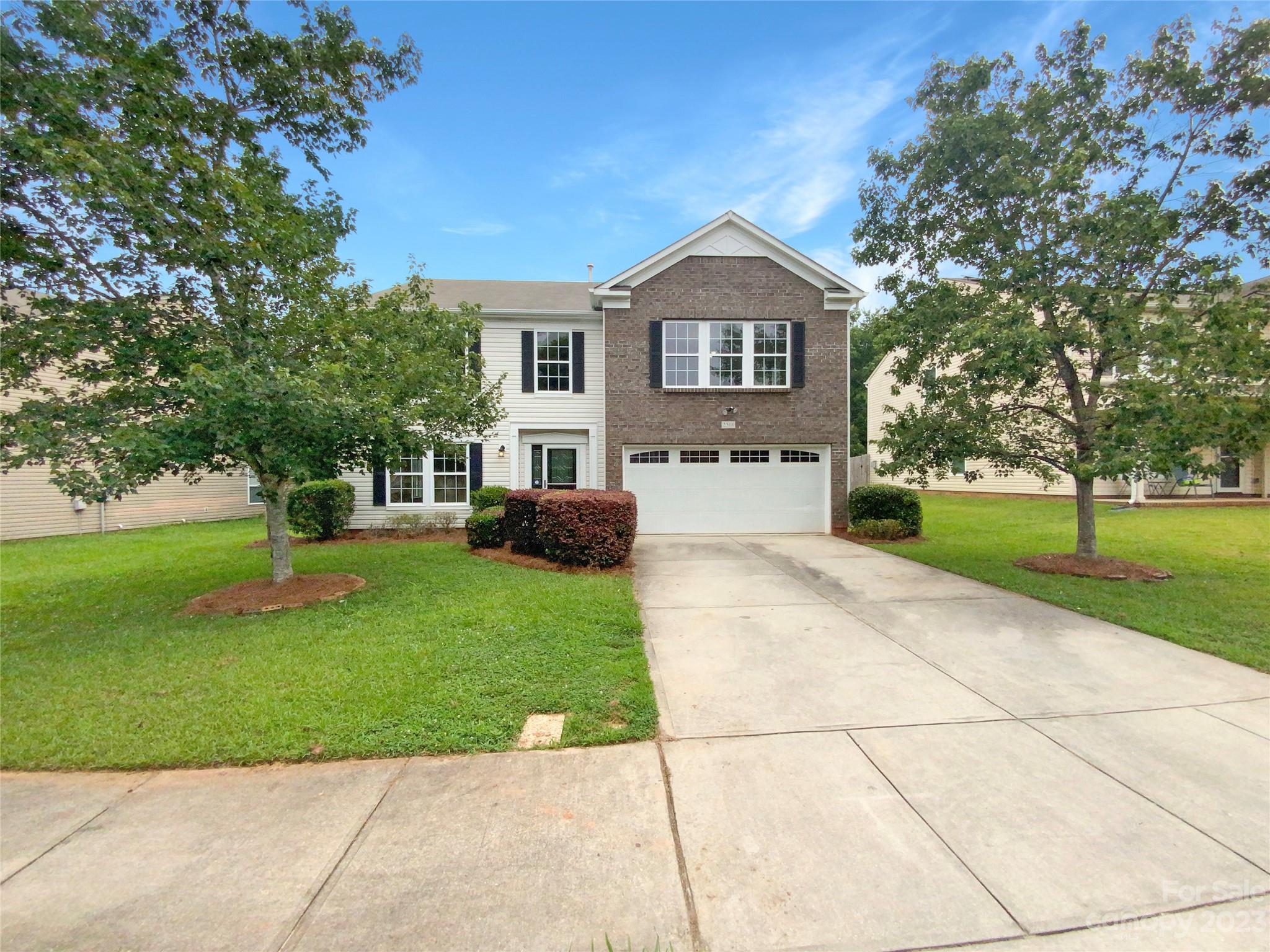 2518 Spring Breeze Way Monroe, NC 28110 - Photo 1 of 22 a front view of a house with a yard