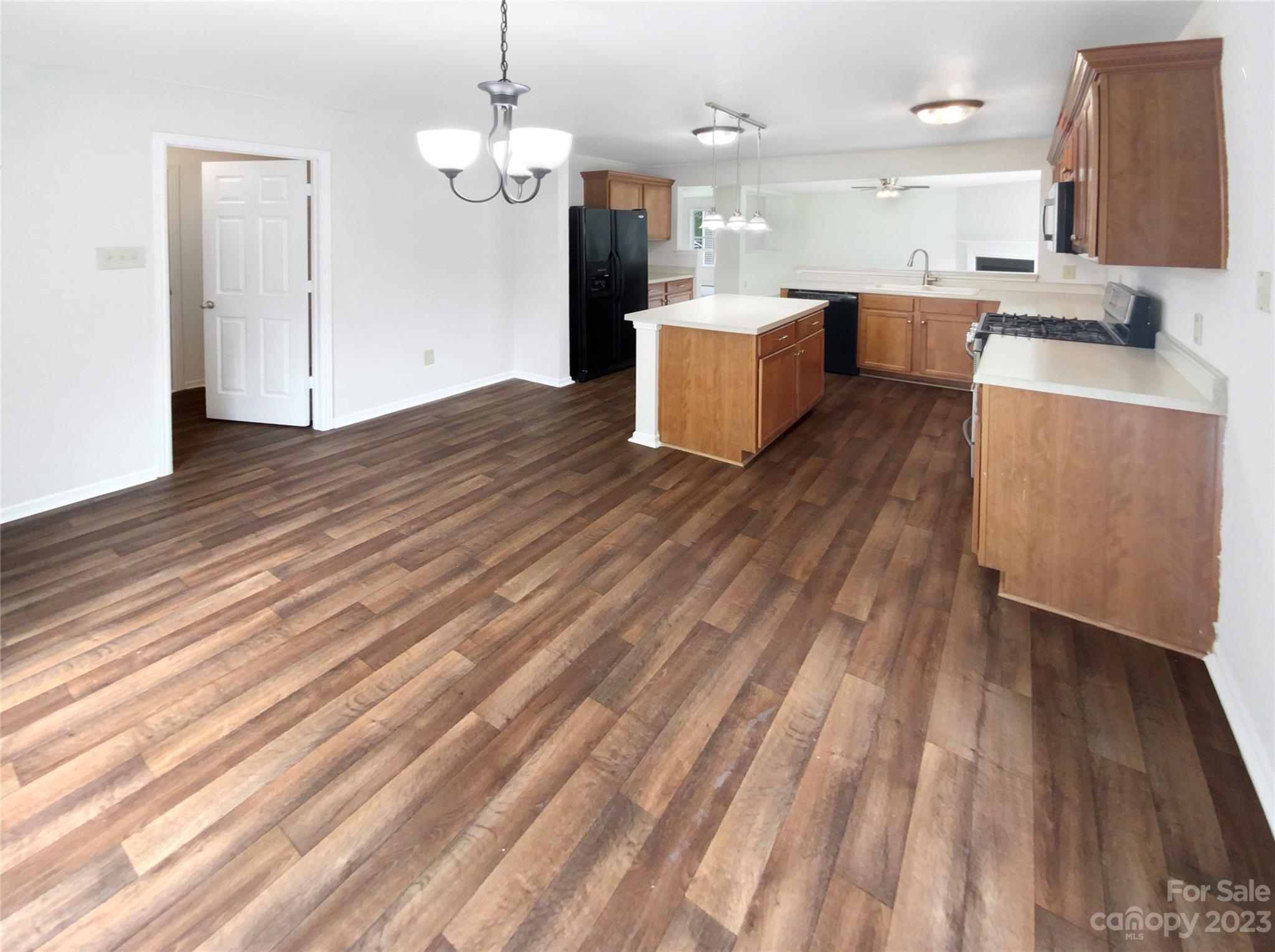 2518 Spring Breeze Way Monroe, NC 28110 - Photo 11 of 22 a view of kitchen and living room