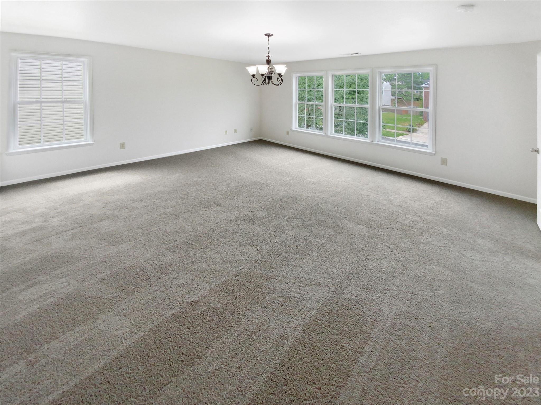 2518 Spring Breeze Way Monroe, NC 28110 - Photo 12 of 22 an empty room with windows