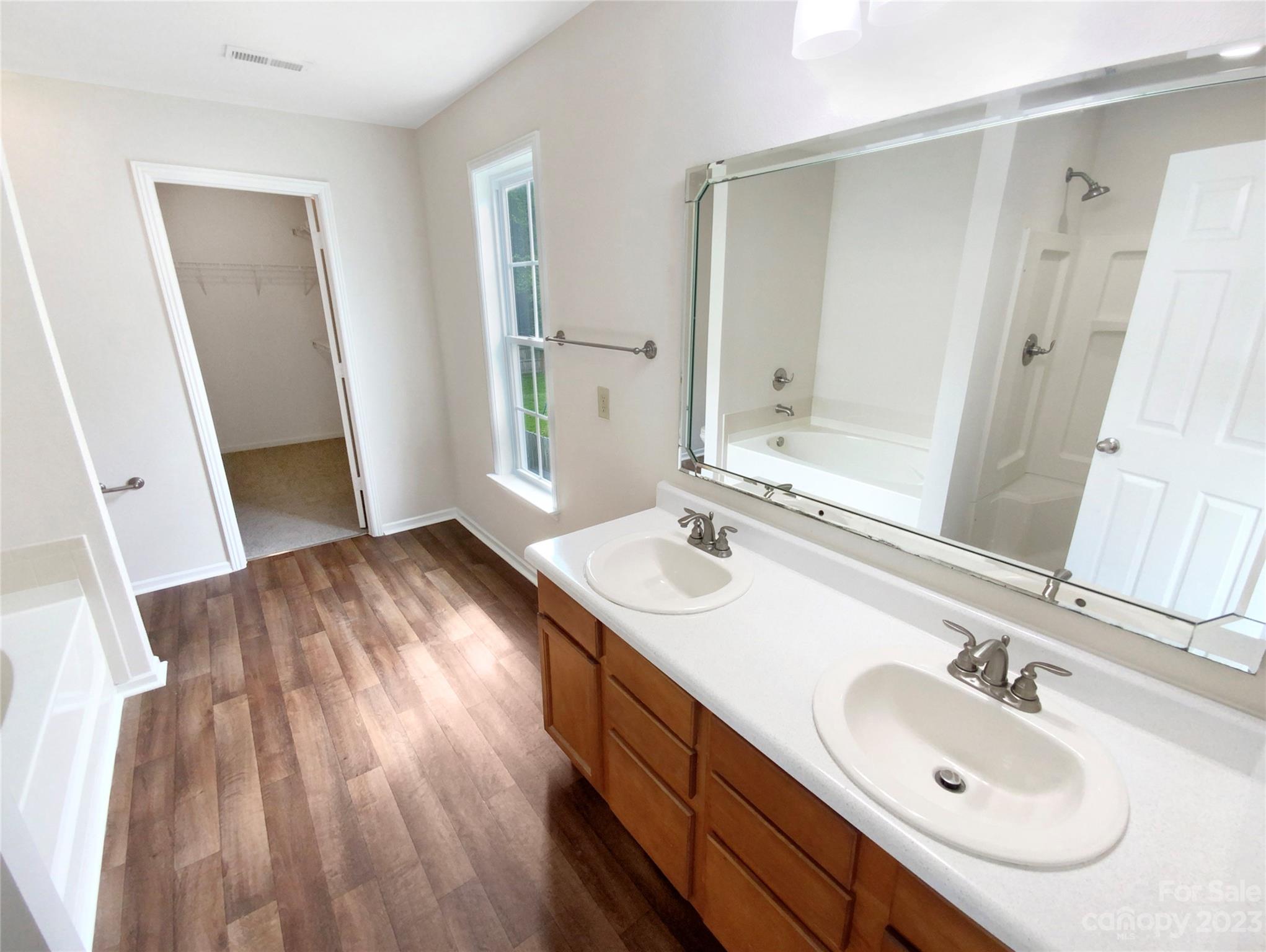 2518 Spring Breeze Way Monroe, NC 28110 - Photo 13 of 22 a bathroom with a sink and a mirror