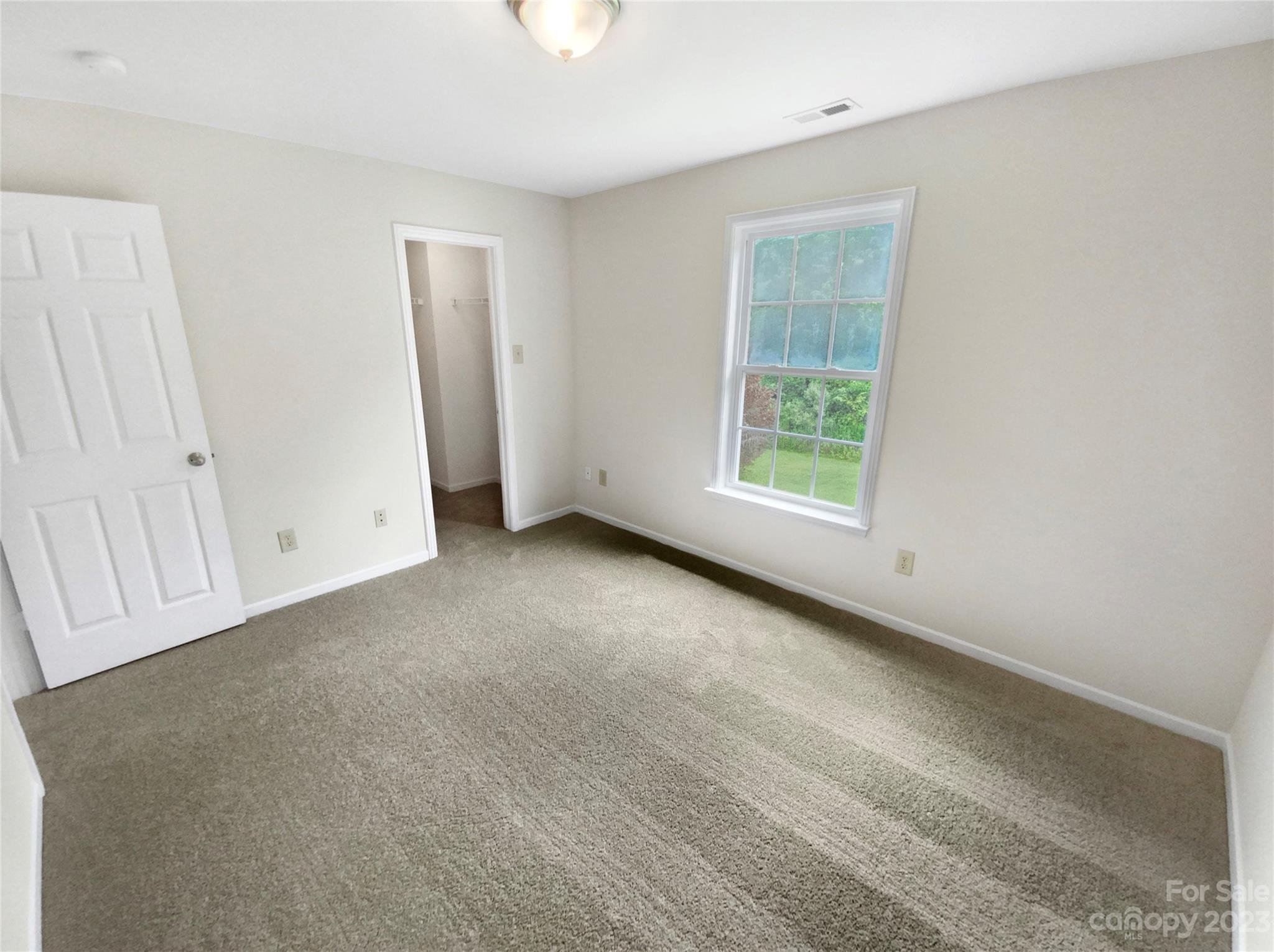 2518 Spring Breeze Way Monroe, NC 28110 - Photo 19 of 22 an empty room with windows
