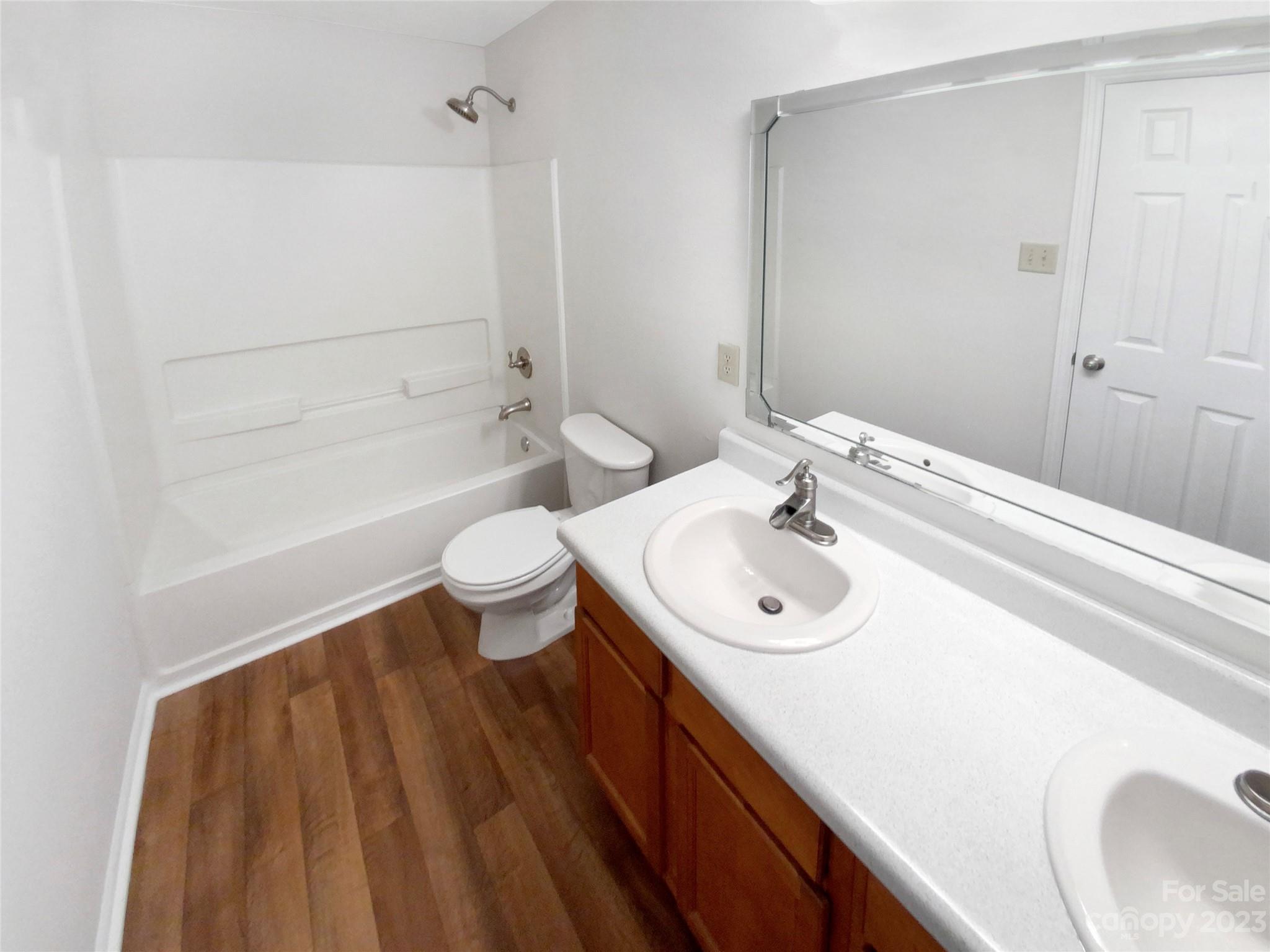 2518 Spring Breeze Way Monroe, NC 28110 - Photo 20 of 22 a bathroom with a sink a toilet and shower