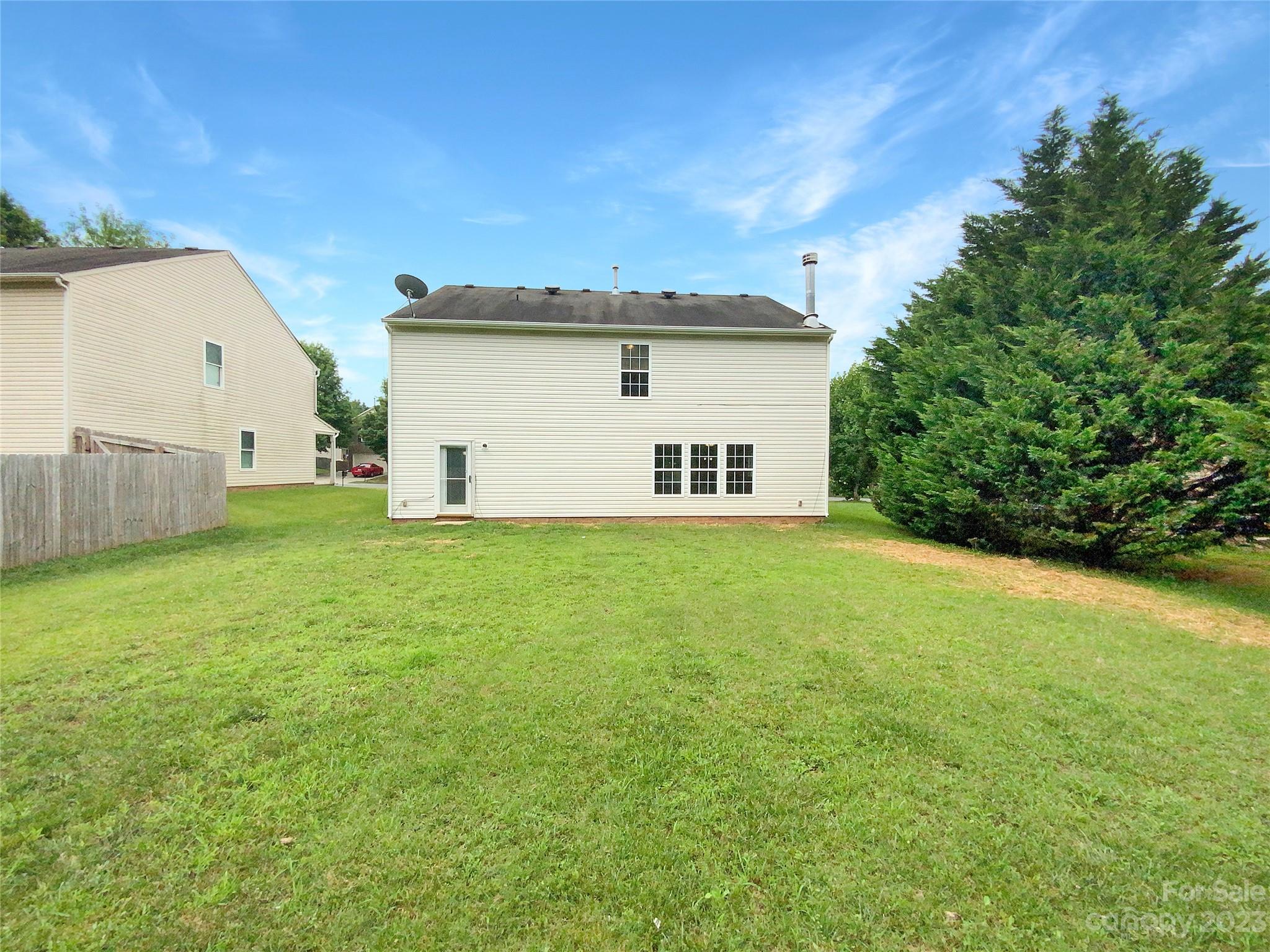 2518 Spring Breeze Way Monroe, NC 28110 - Photo 22 of 22 a view of a backyard with a garden and plants