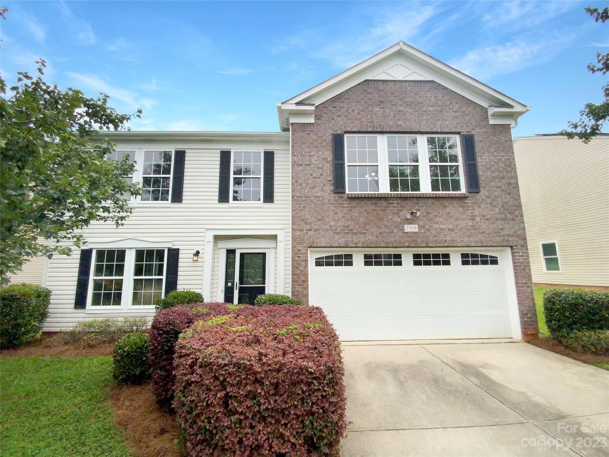 2518 Spring Breeze Way Monroe, NC 28110 - Photo 6 of 22 a front view of a house with a yard