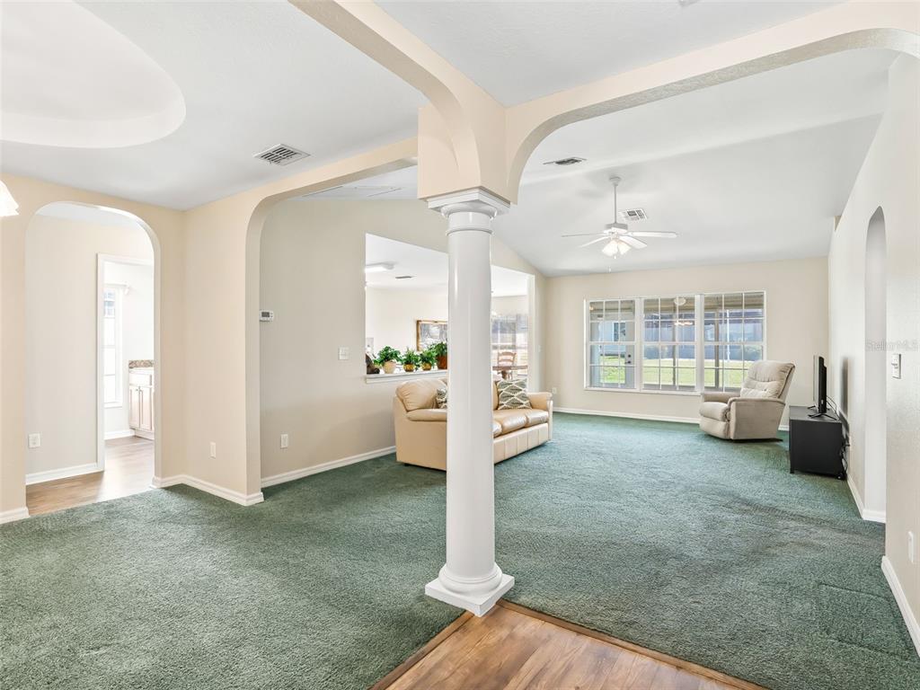 12321 Southeast 176th Loop Summerfield, FL 34491 - Photo 4 of 51 a view of a livingroom with furniture and an entryway