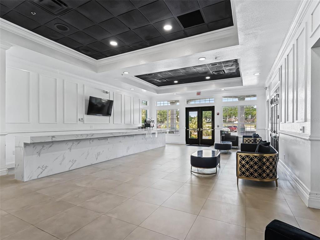 12321 Southeast 176th Loop Summerfield, FL 34491 - Photo 44 of 51 a lobby with furniture and fireplace