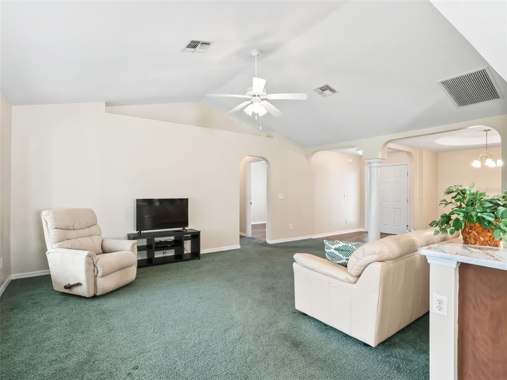 12321 Southeast 176th Loop Summerfield, FL 34491 - Photo 8 of 51 a living room with furniture and a flat screen tv