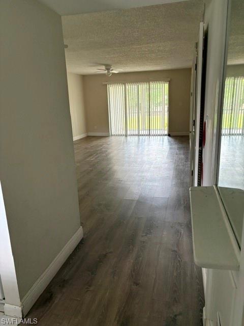 5651 Rattlesnake Hammock Road, Unit C108 Naples, FL 34113 - Photo 9 of 14 wooden floor in an empty room with a window