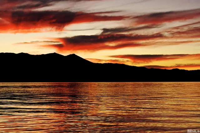 a view of ocean with sunset