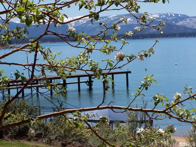 an aerial view of a house with outdoor space