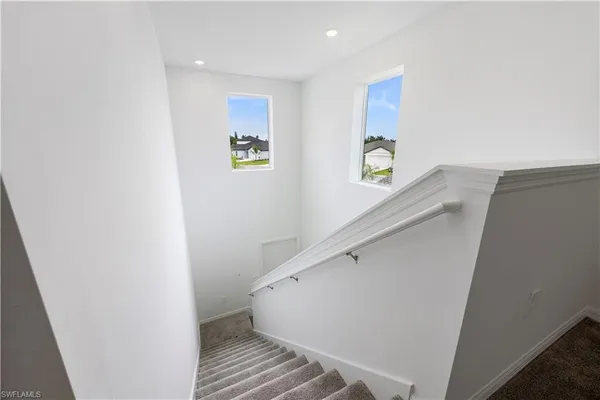 a view of entryway with stairs and wooden floor