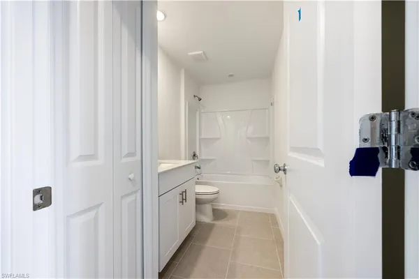 a bathroom with a tub sink and toilet