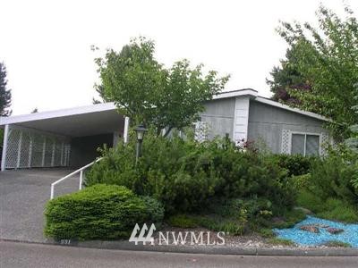 901 241st Place Southwest Bothell, WA 98021 - Photo 1 of 1 a yellow house with trees in front of it