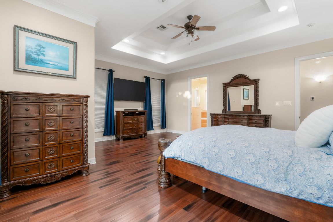 209 Goldridge Drive Georgetown, TX 78633 - Photo 19 of 40 a bedroom with a bed and wooden floor